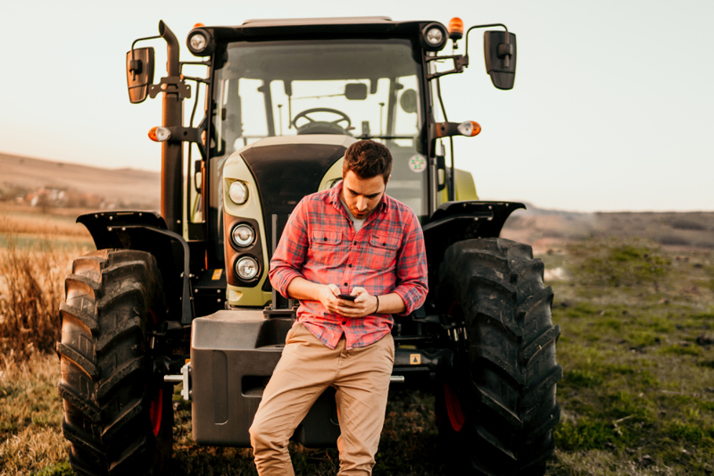 farmer looking at phone