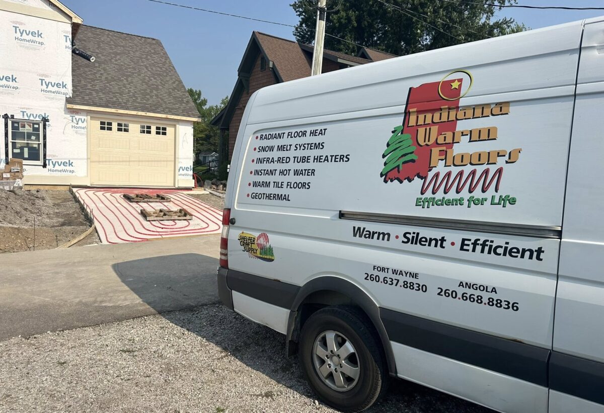 Indiana Warm Floors service van beside a new garage slab with radiant heating tubing installed